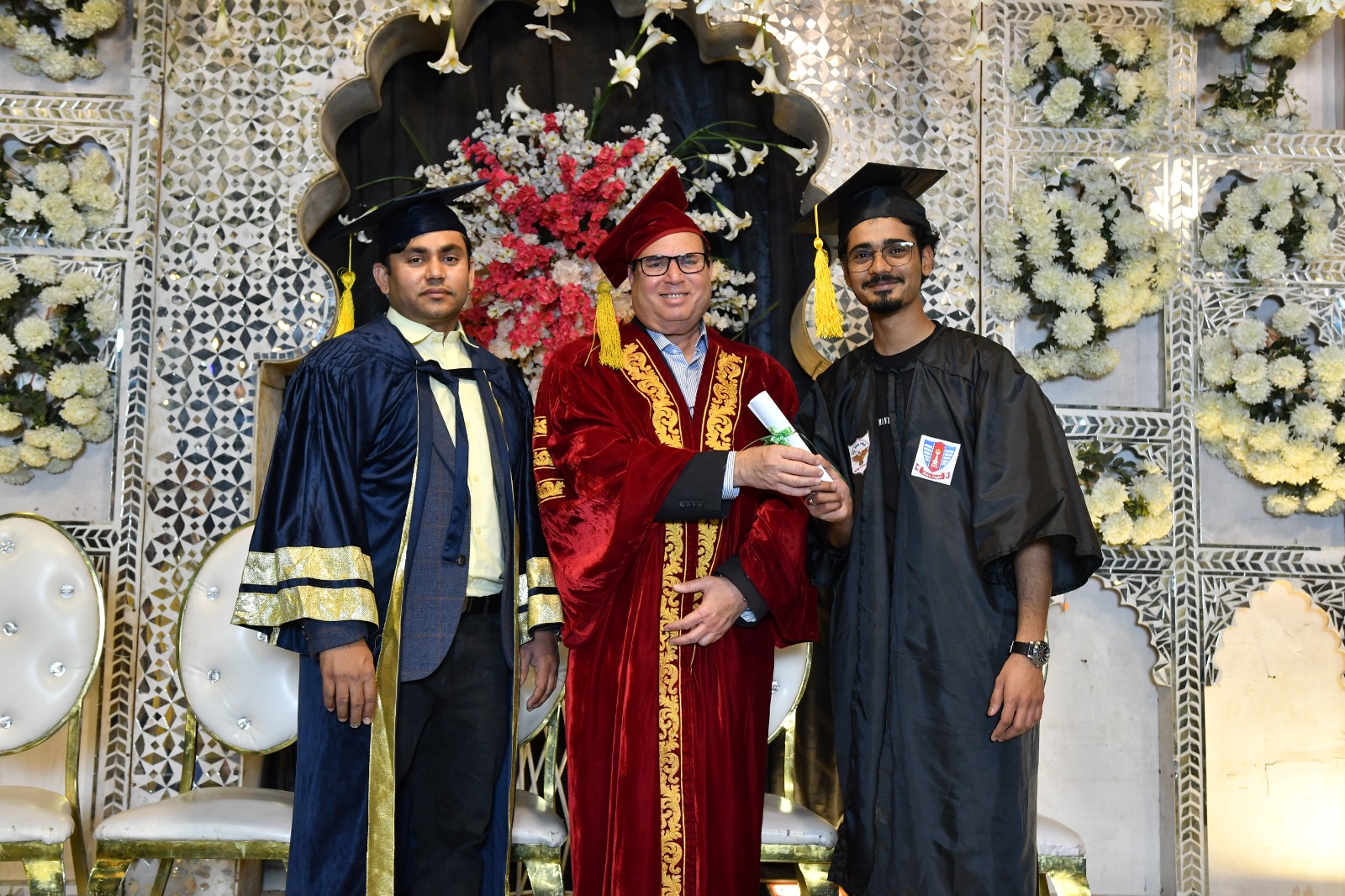 Graduates with the President in ceremonial robes at the UEWS convocation