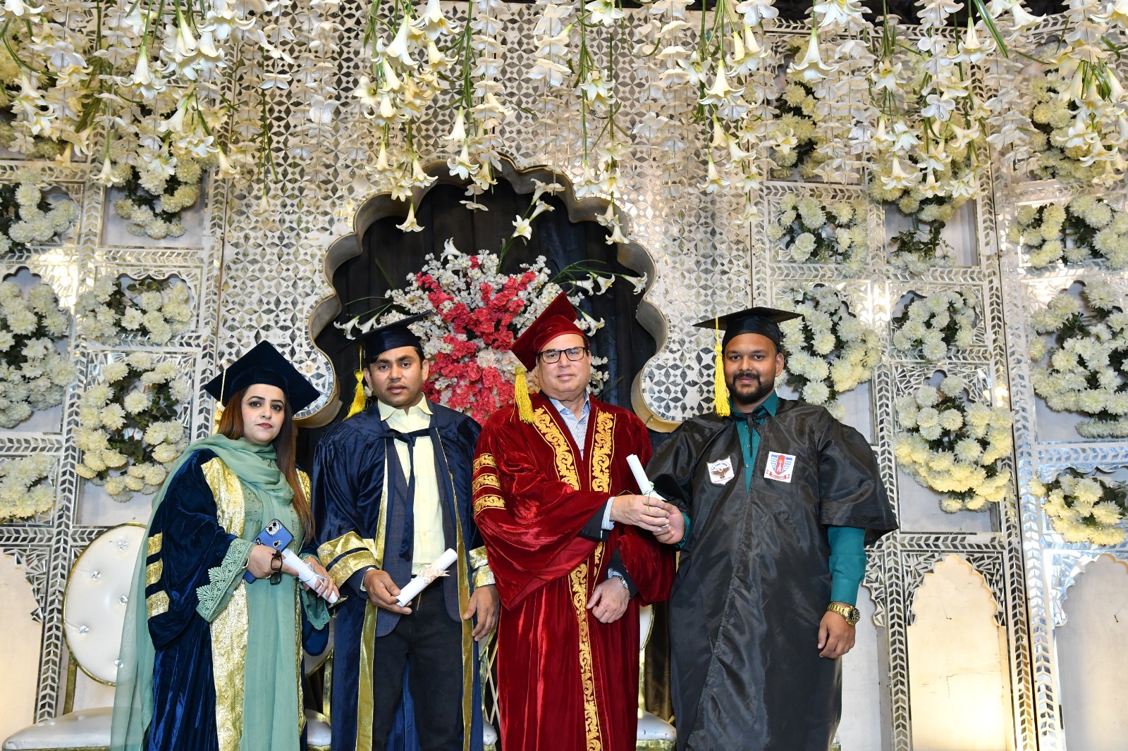 Graduating students and faculty on stage at the UEWS convocation
