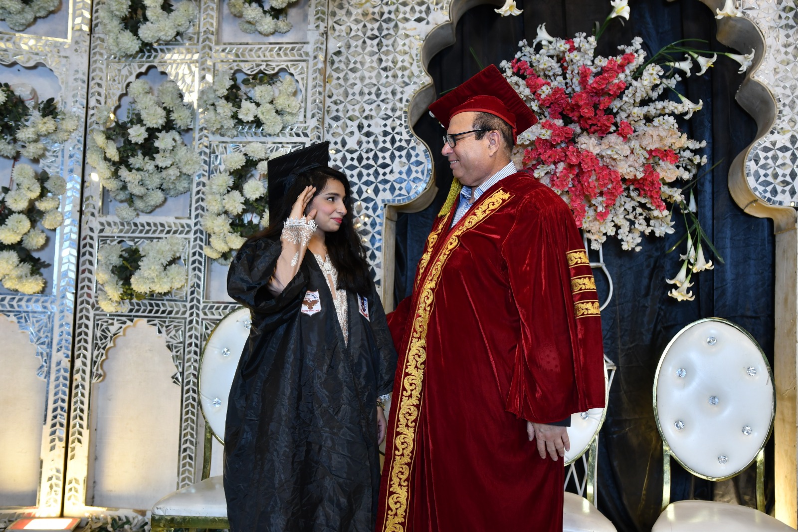 A graduate greeting the President at the UEWS convocation